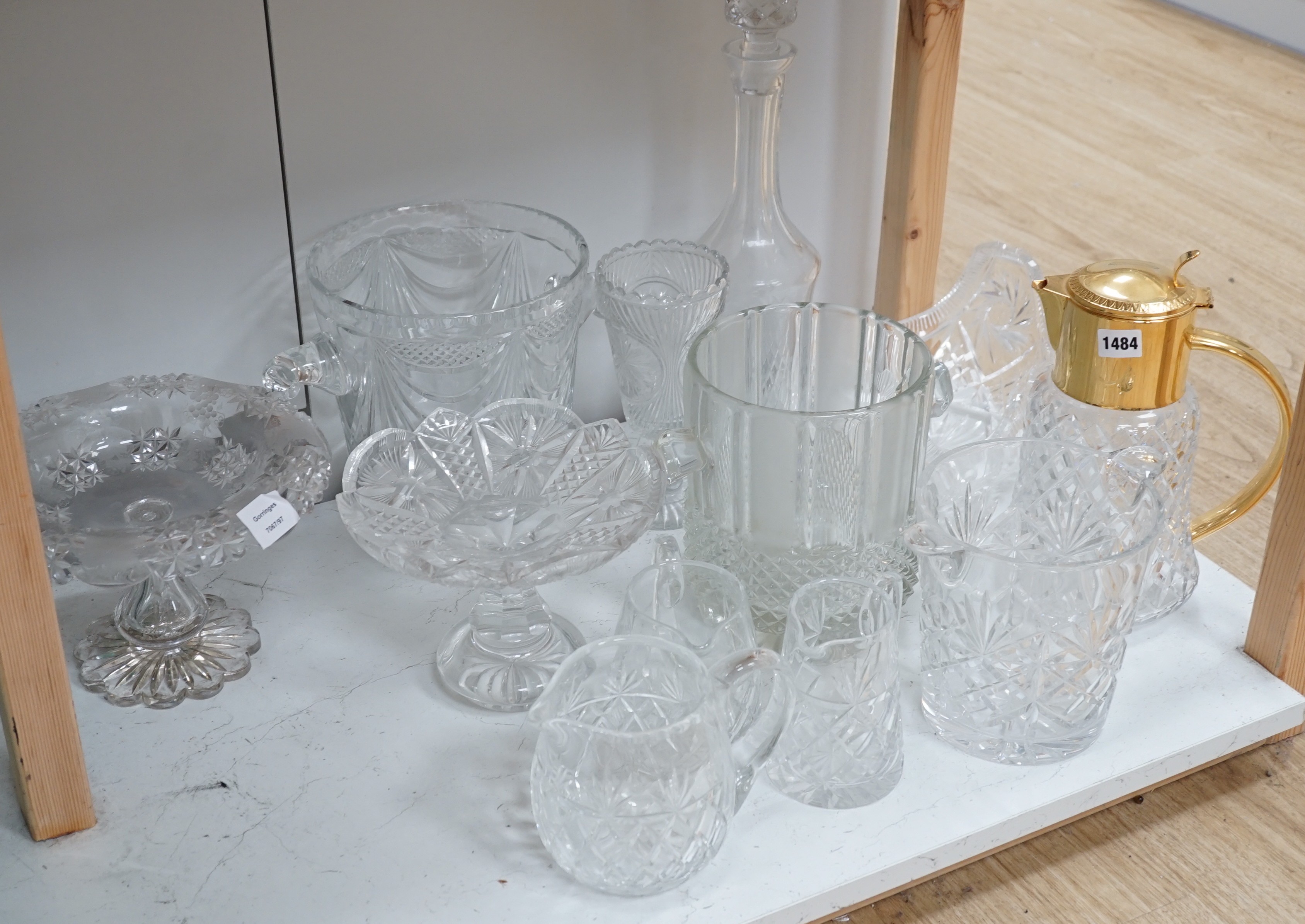 Three assorted cut glass ice buckets, two pedestal dishes, a gilt metal mounted lidded jug etc